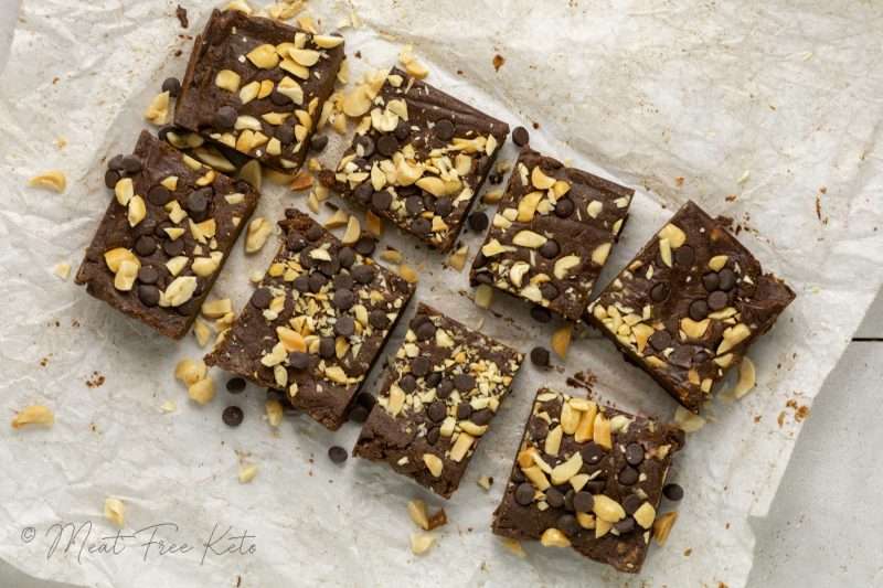 a stack of vegan keto peanut butter chocolate protein bars, showing the garnish