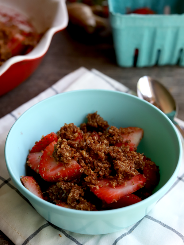 a bowl of raw strawberry crumble